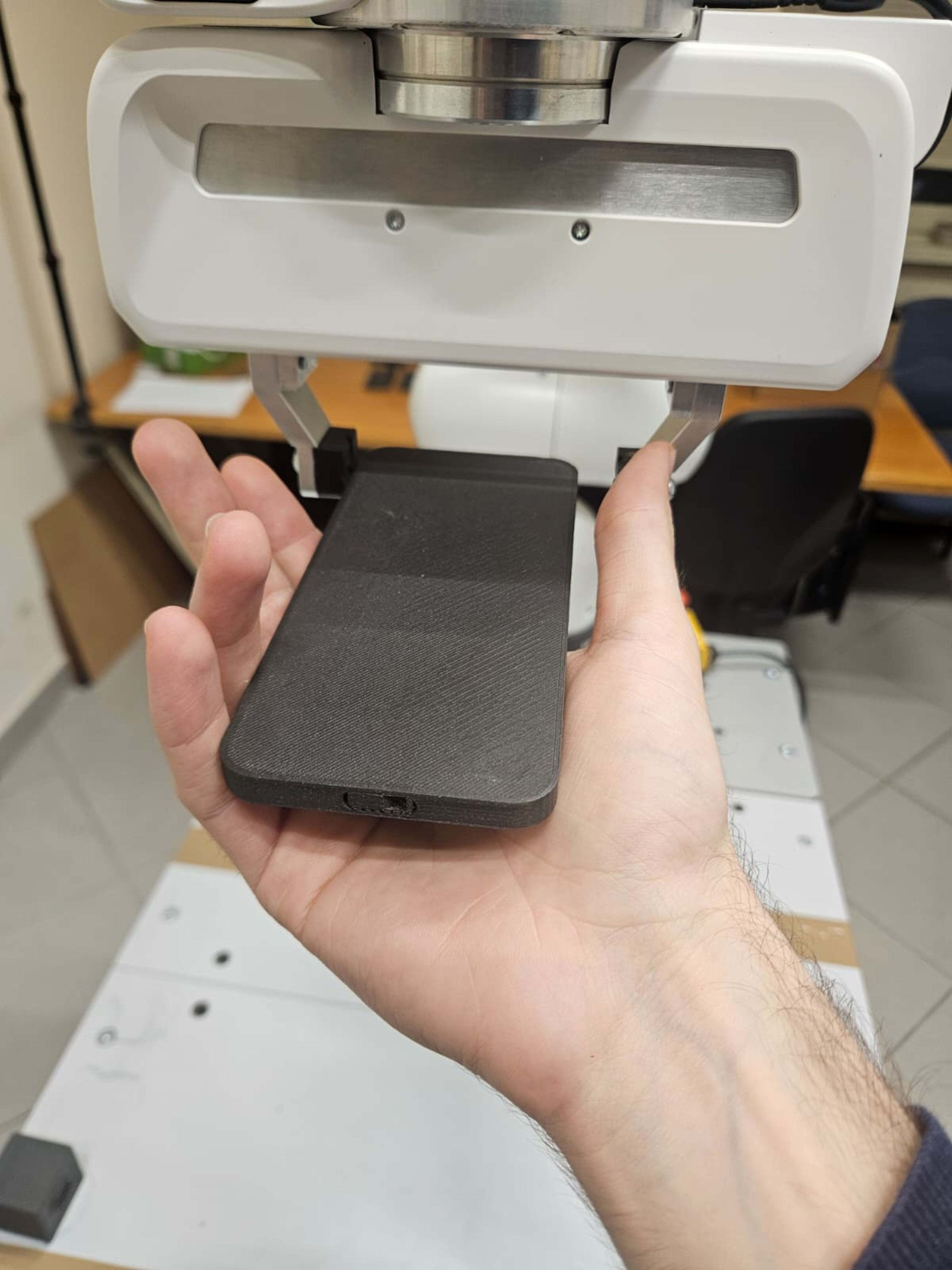 Smartphone grip for charging - plug accessible
